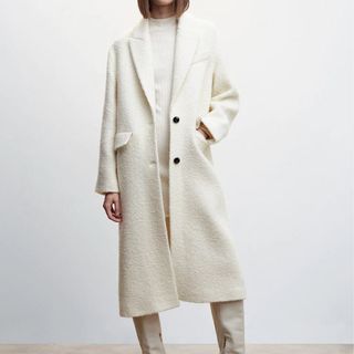 model wearing long white tailored coat