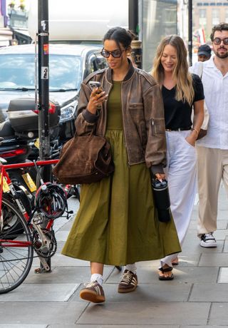 Rochelle wears a dress and trainers.