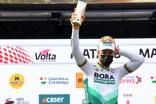 MATAR SPAIN MARCH 27 Podium Peter Sagan of Slovakia and Team BORA Hansgrohe Celebration during the 100th Volta Ciclista a Catalunya 2021 Stage 6 a 1938km stage from Tarragona to Matar Trophy Mask Covid Safety Measures VoltaCatalunya100 on March 27 2021 in Matar Spain Photo by David RamosGetty Images
