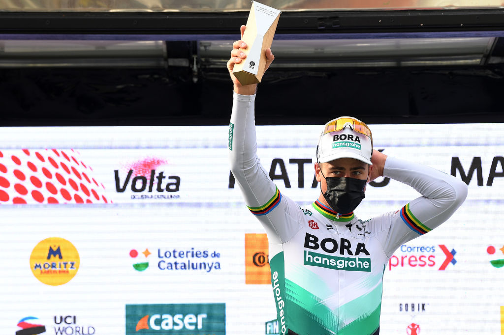 MATAR SPAIN MARCH 27 Podium Peter Sagan of Slovakia and Team BORA Hansgrohe Celebration during the 100th Volta Ciclista a Catalunya 2021 Stage 6 a 1938km stage from Tarragona to Matar Trophy Mask Covid Safety Measures VoltaCatalunya100 on March 27 2021 in Matar Spain Photo by David RamosGetty Images