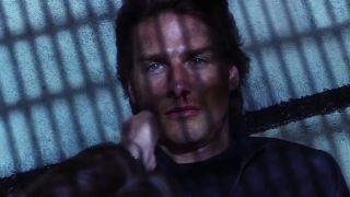 Tom Cruise as Ethan Hunt, about to be revealed to be Richard Roxburgh as Hugh Stamp in Mission: Impossible 2