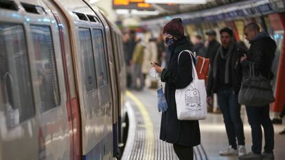 Woman wearing mask on the London Underground