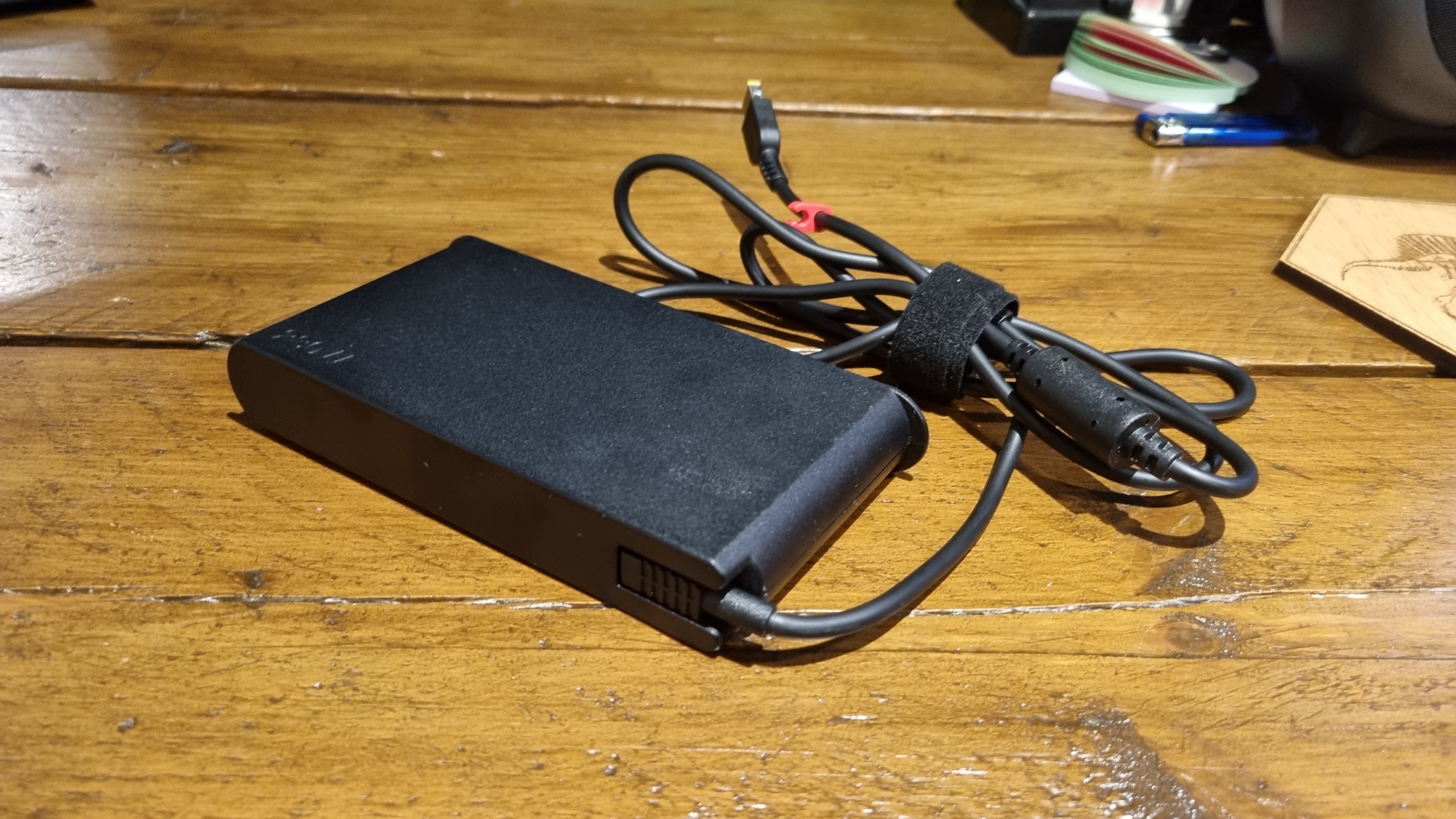 The charging brick/power adaptor of the Lenovo Legion 7 16IRX9