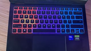 HP Omen Transcend 14 gaming laptop keyboard close up with RGB lighting on