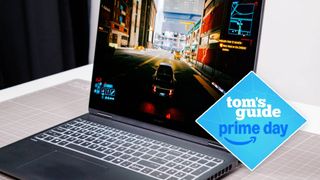 HP Omen Max 16 side view on table with Cyberpunk 2077 on display with Tom's Guide Prime Day badge