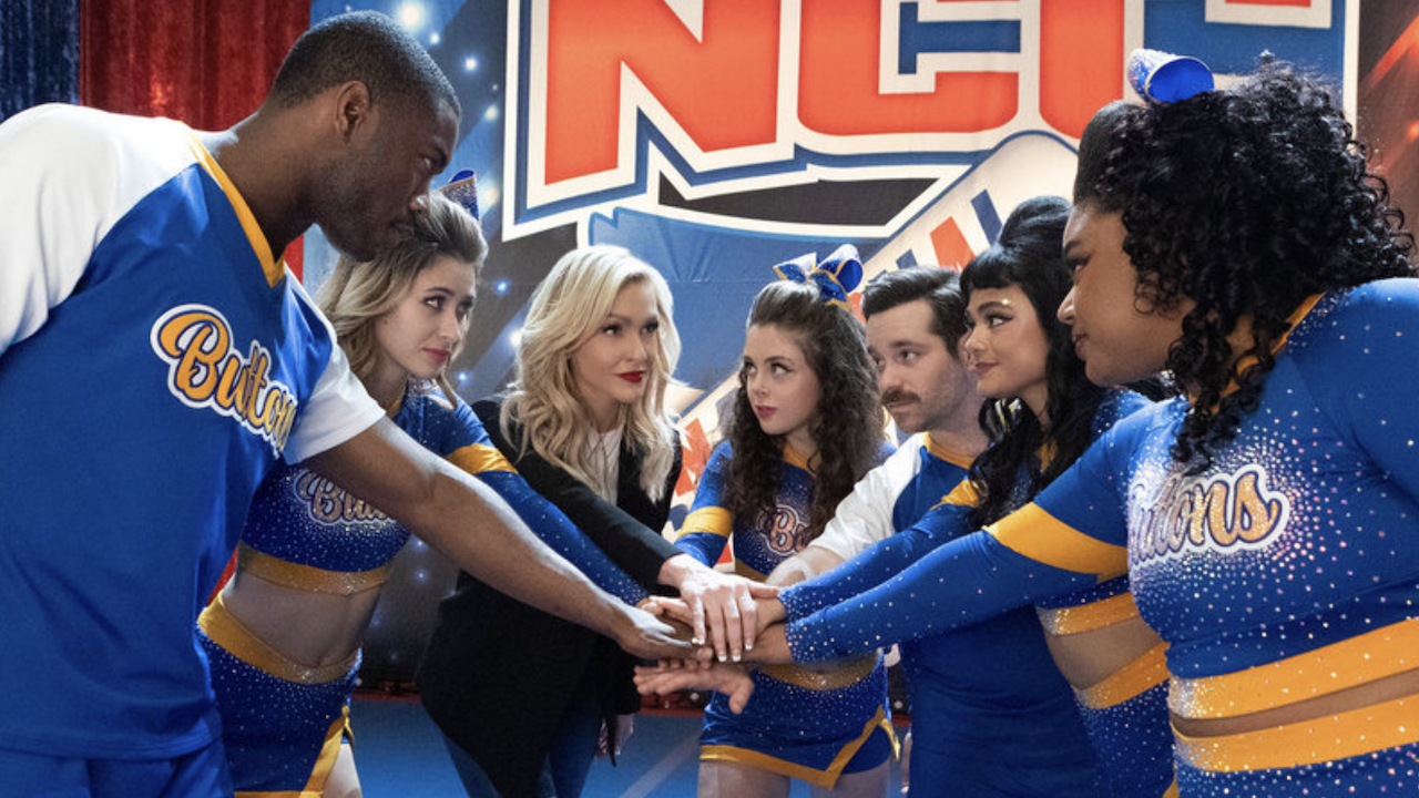 Coach Courteney leading the team in a group cheer in Stumble.