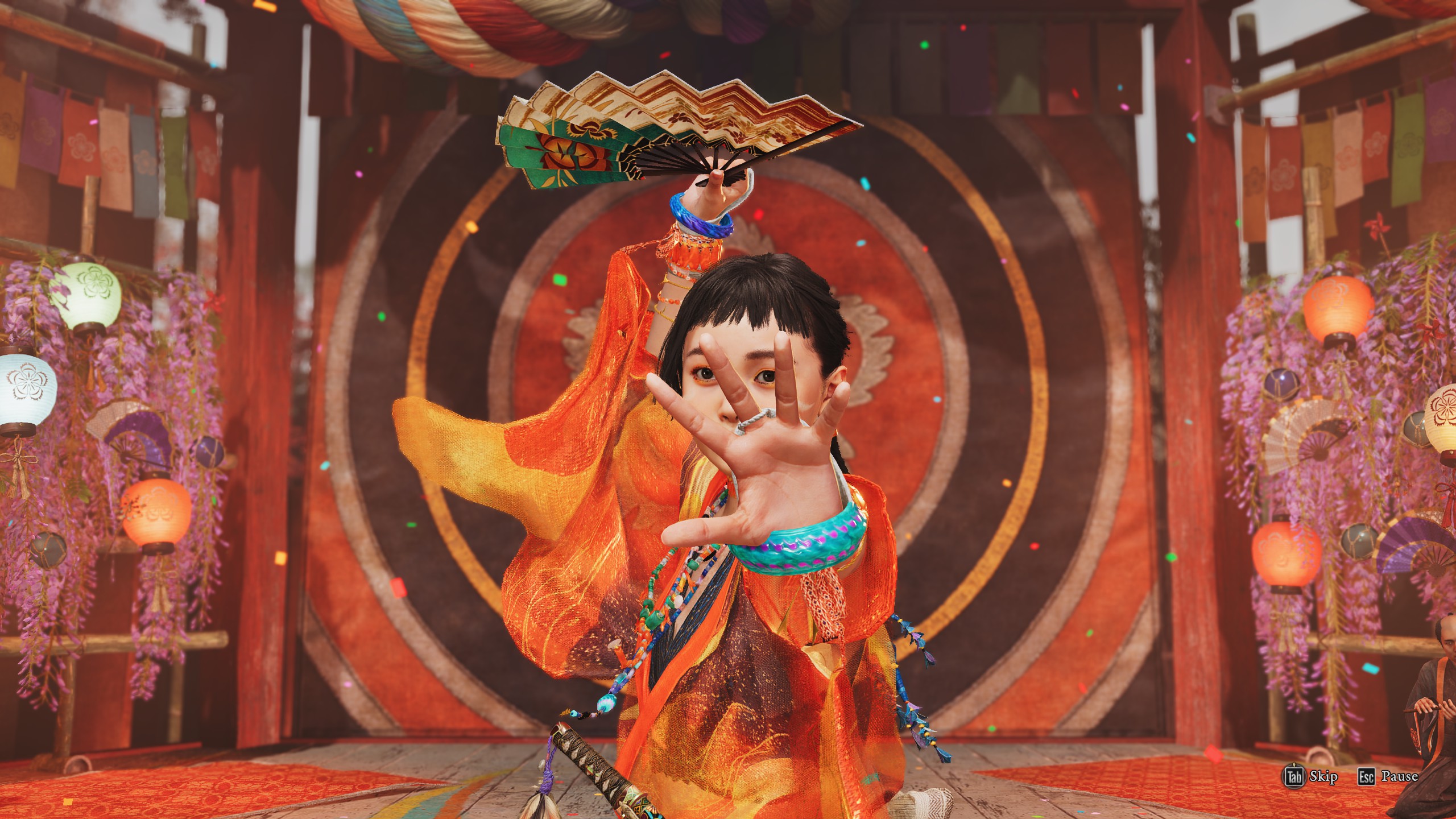 A young girl dancing in bright orange clothing in Onimusha: Way of the Sword