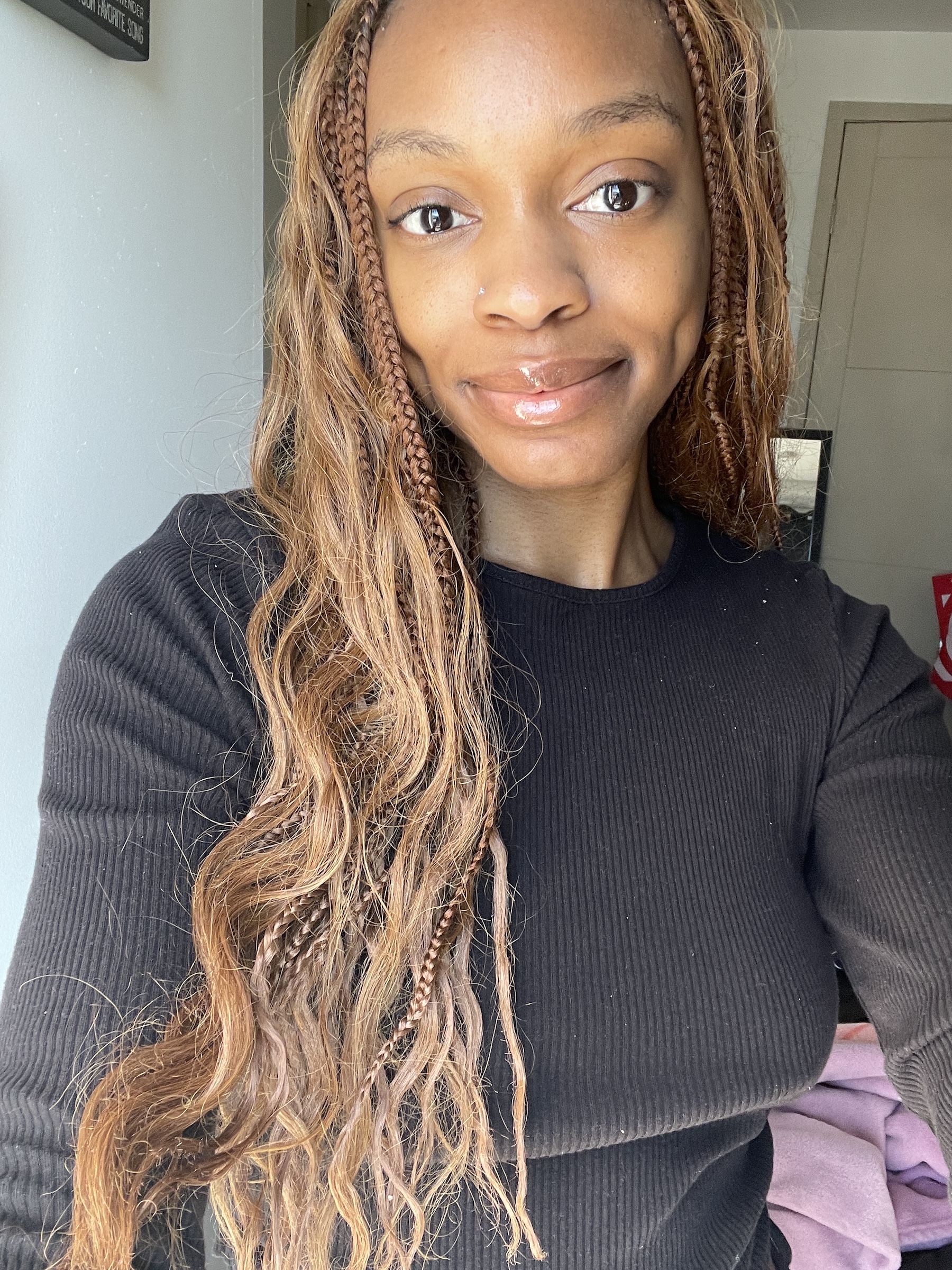 a person with light brown hair wearing no makeup