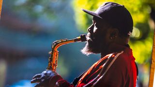 A close up of an A4 color print made with the PIXMA TR7650 showing the fine details in color and hairs of a street musician playing a saxophone