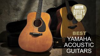 A pair of Yamaha acoustic guitars sat up in their cases