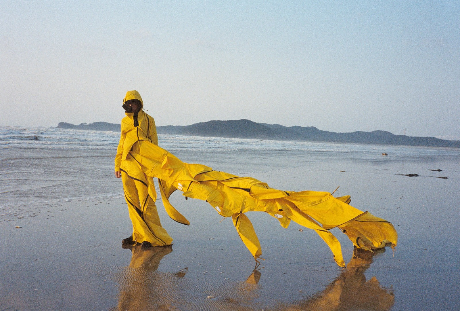 Man wearing Post Archive Faction on beach