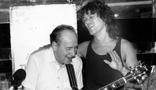 Les Paul (left) on stage with Eddie Van Halen at Fat Tuesdays in New York City