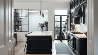 navy kitchen with white worktops and Belgian doors