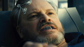 A man with cranial electrodes and a mouthguard