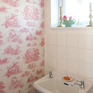 bathroom with wallpaper and tiles