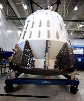 The Dragon test article is displayed at SpaceX Headquarters. It will be used for upcoming testing.