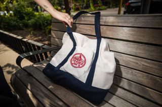 Trader Joe's bag on a bench.