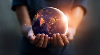 Holding world globe in hands