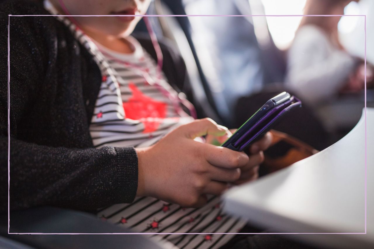 A close up of a teenage girl on a smartphone