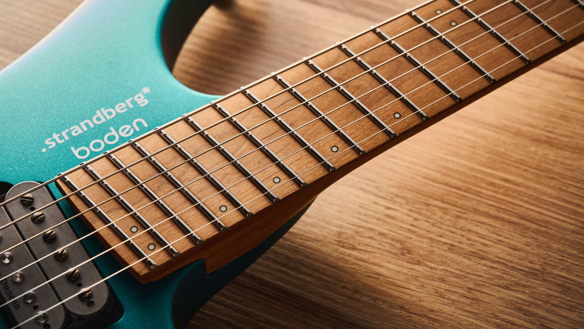 Strandberg N2 Boden Standard in Transformative Teal, shot in close-up and against a pale wooden floor.