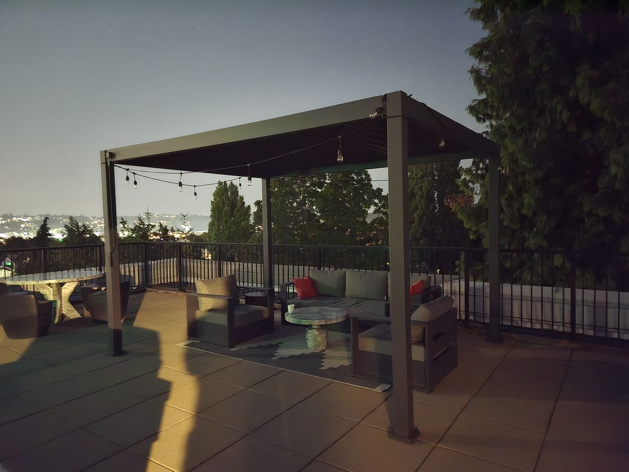 Couches under a pergola at night