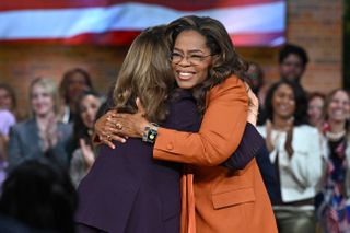 Oprah and Kamala Harris hug at a rally