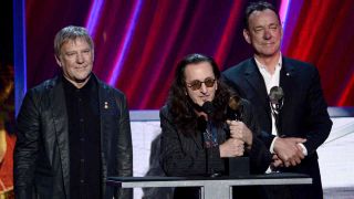 Rush onstage at the Rock And Roll Hall Of Fame induction ceremony in 2013