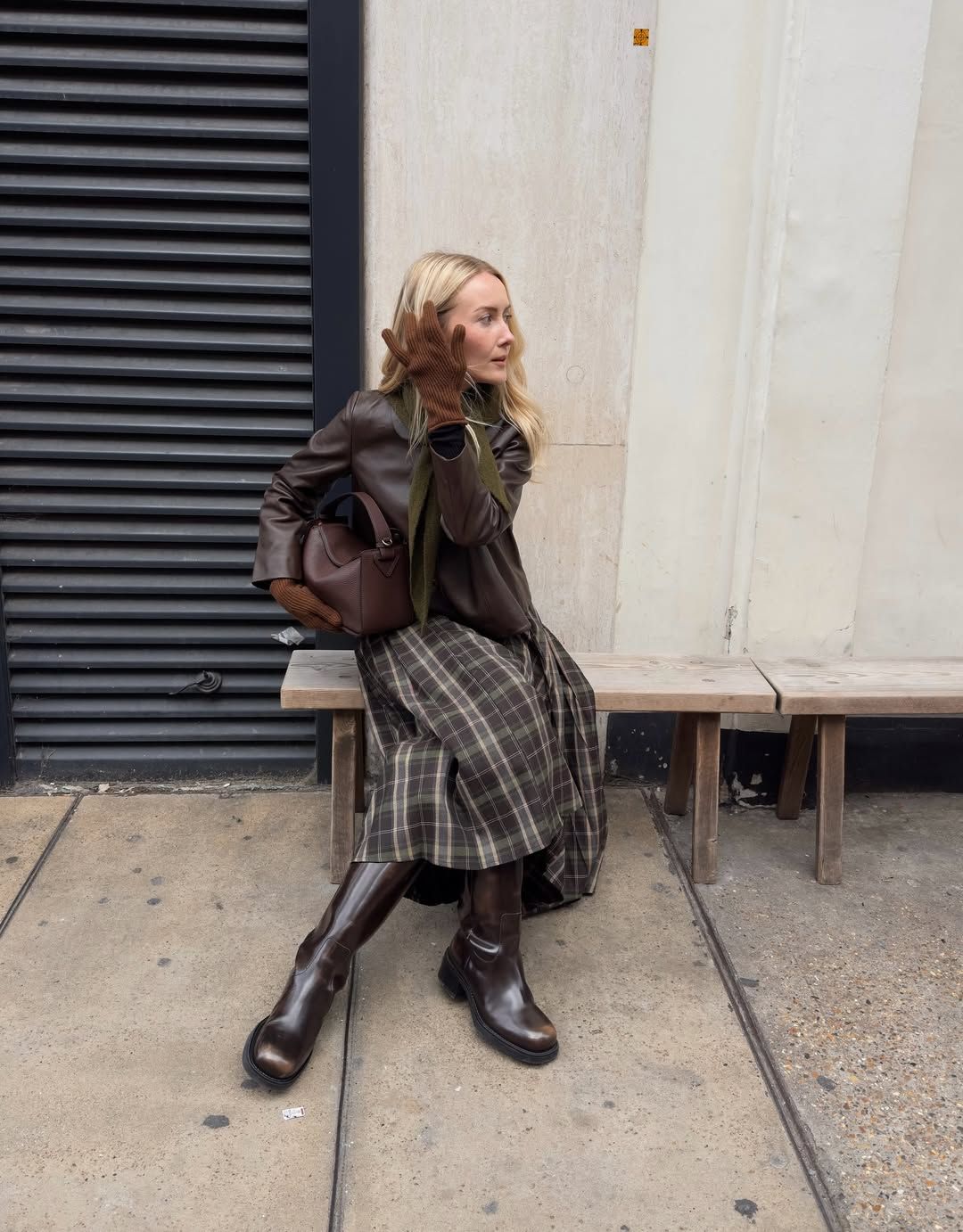 Chloe wearing checked skirt