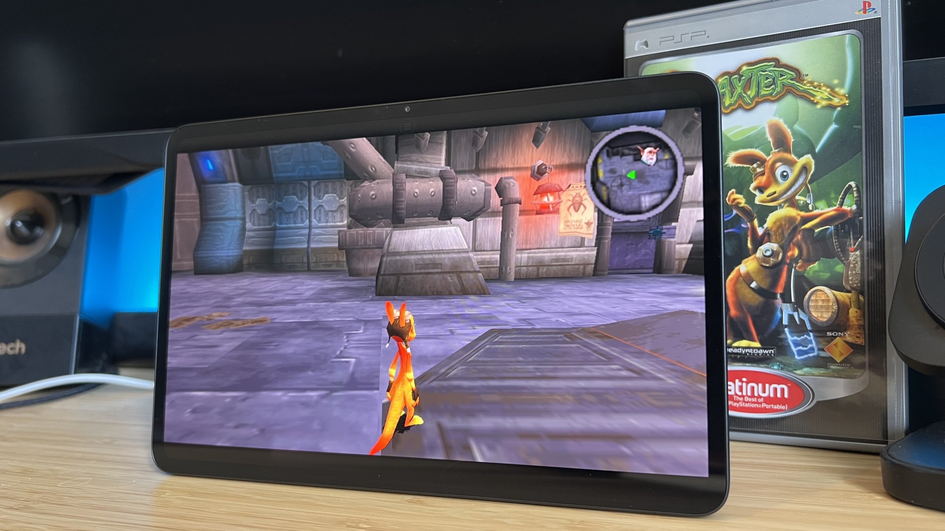 RedMagic Astra 2 gaming tablet running Daxter with the PSP case in the background