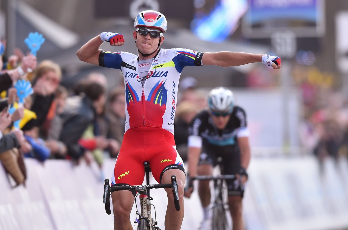 Alexander Kristoff celebrates as Nikki Terpstra hangs his head