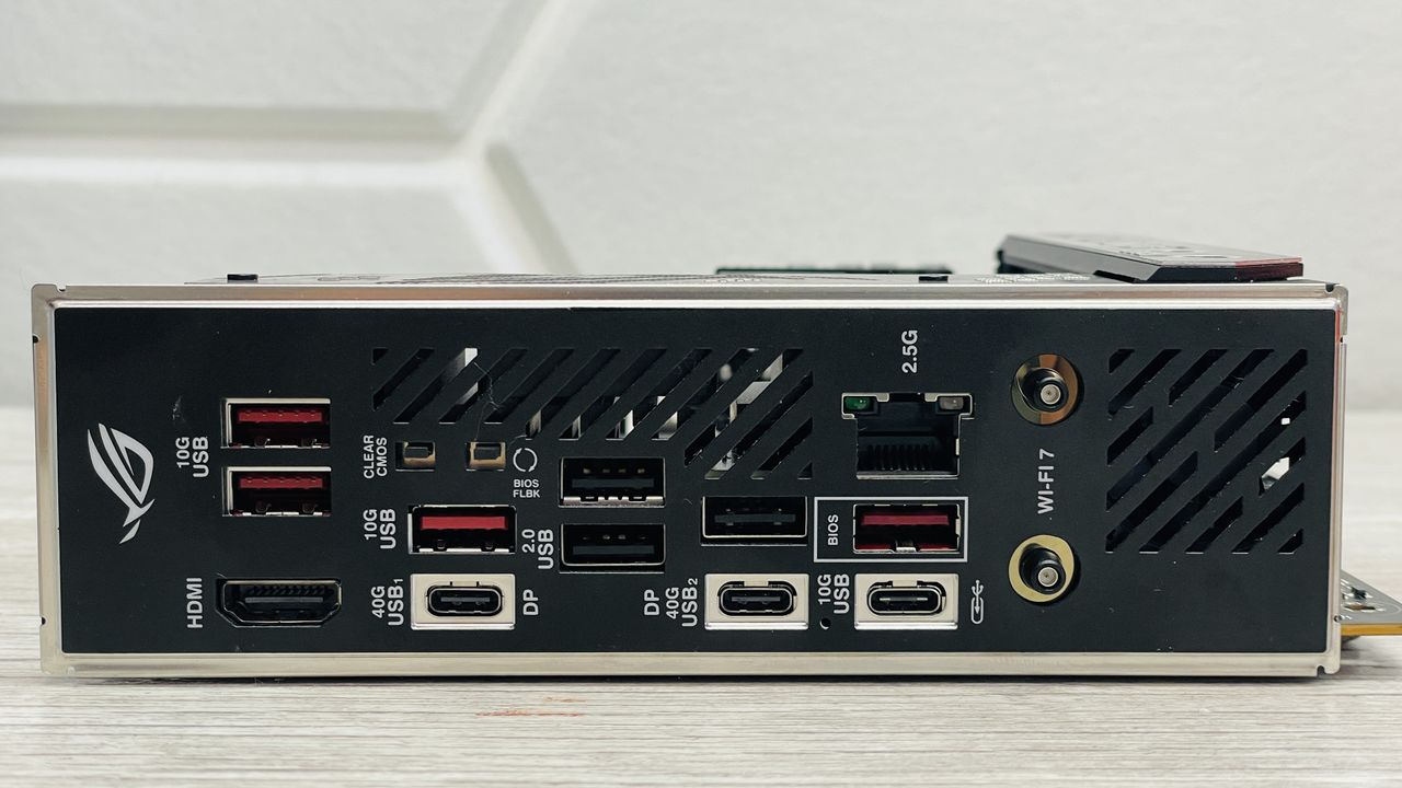 Asus ROG Strix X870-I Gaming WiFi motherboard on a desk.