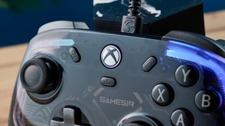 The GameSir Kaleid wired Xbox/PC controller. The photo is a close up of the Xbox button.