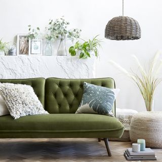 living room with green sofa and cushions