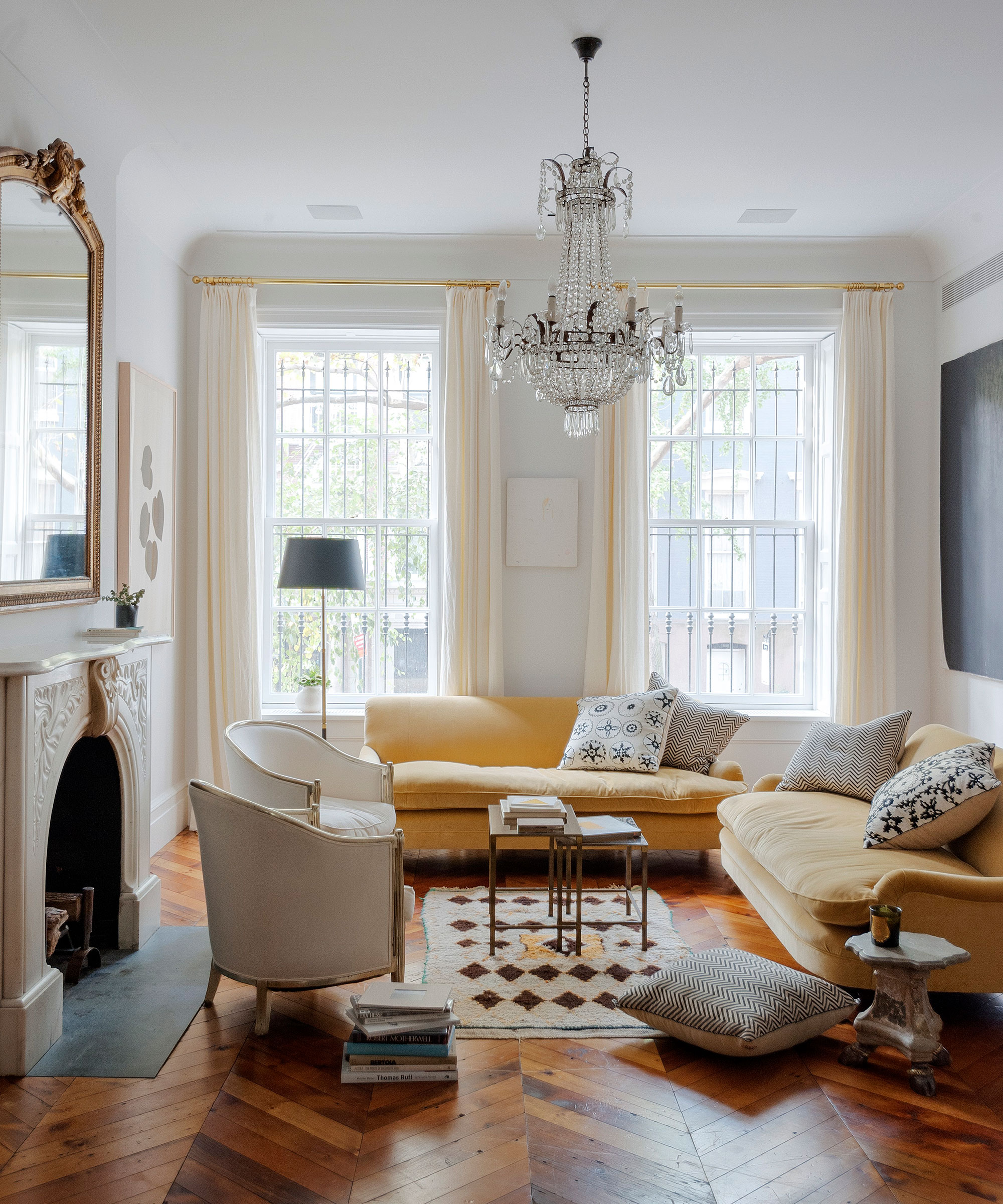 A small living room ideas with white walls, wood floor and yellow accents