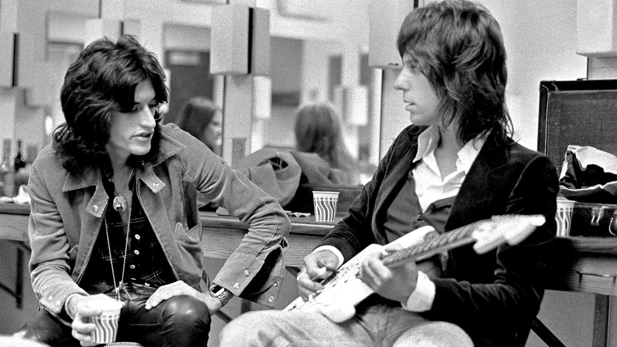 Joe Perry (left) and Jeff Beck chat backstage at The Providence Civic Center on October 7, 1976 