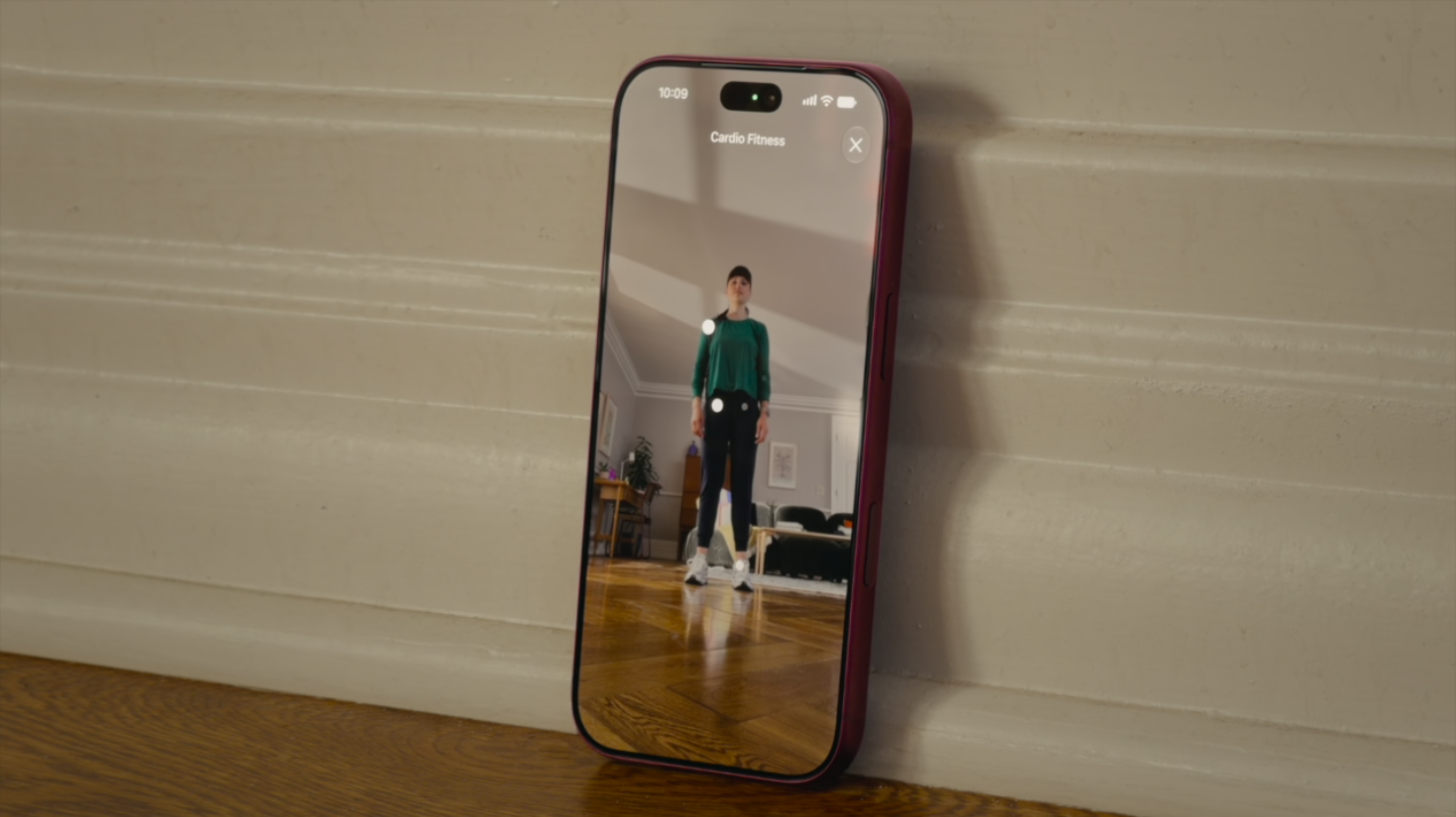 An iPhone recording a guided video fitness assessment