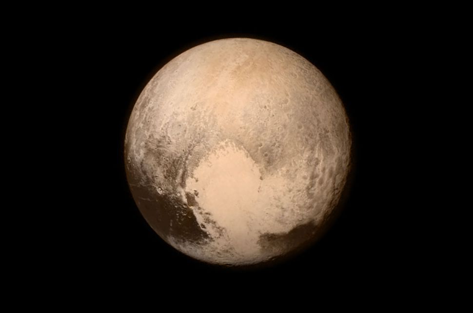 New Horizons&#039; photo of Pluto showing the heart-shaped area now informally named Tombaugh Region.