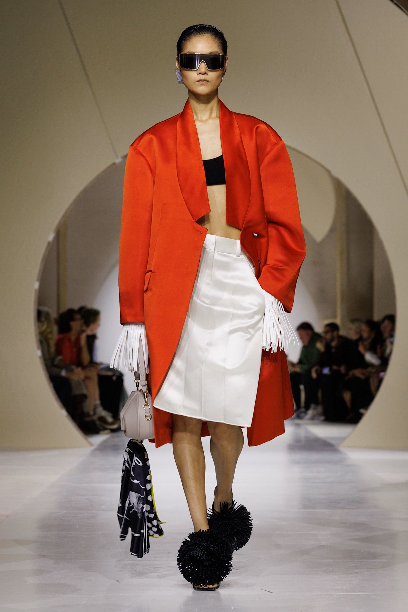 Spring/summer 2027 model wearing a bra top on the runway during fashion month.