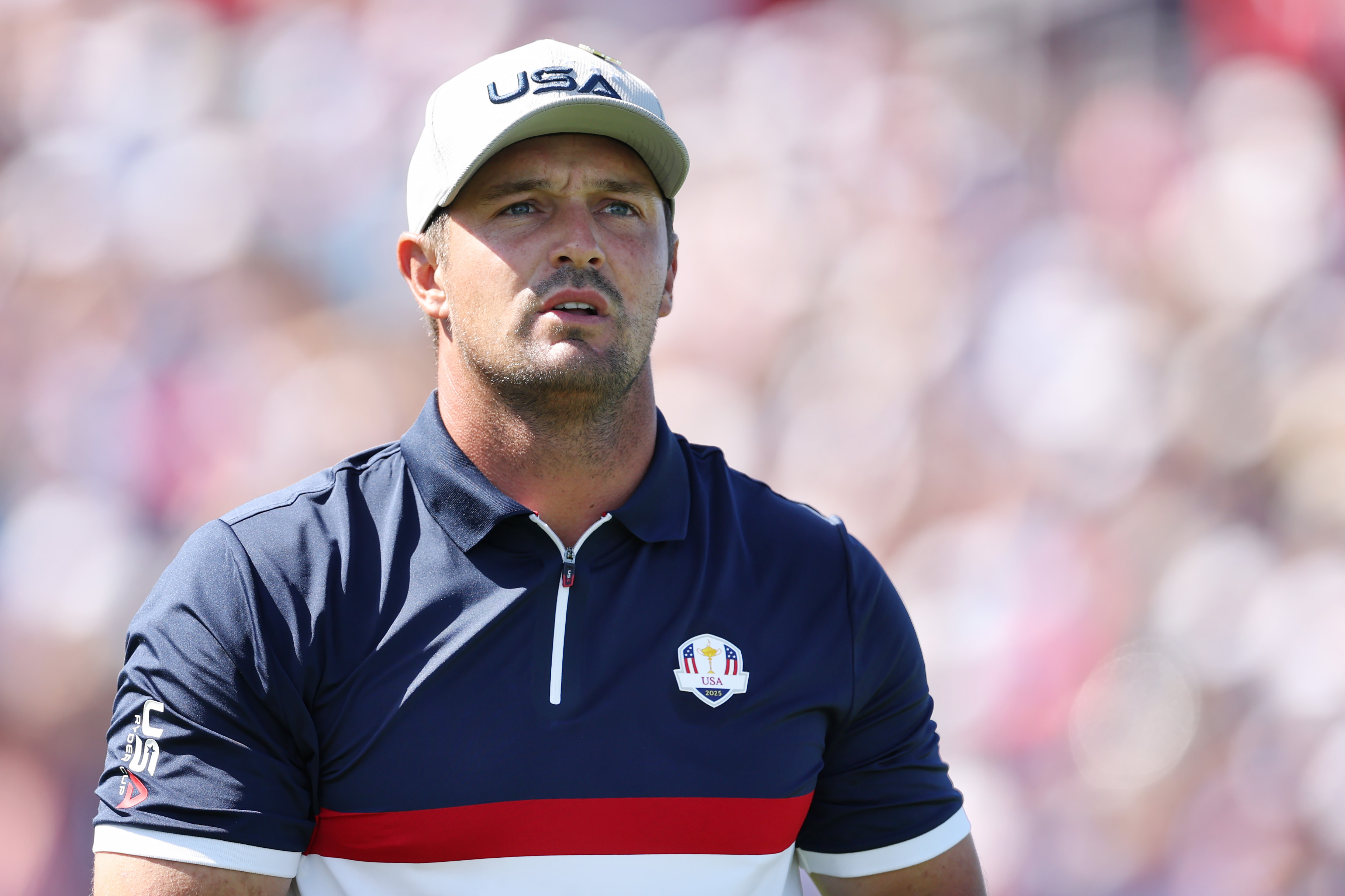 Bryson DeChambeau walks off the tee