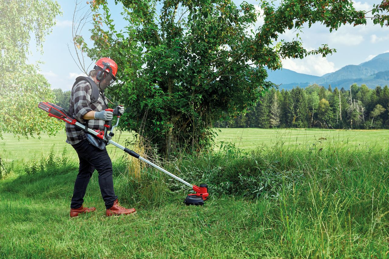 Einhell AGILLO 18/200 Cordless Scythe being used to maintain fields