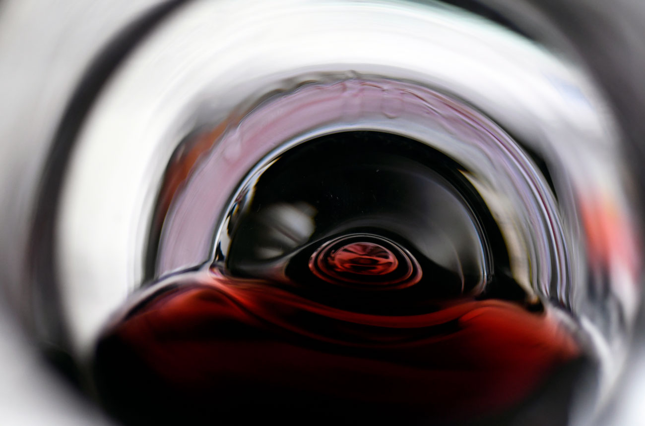 Red wine swirling in a glass