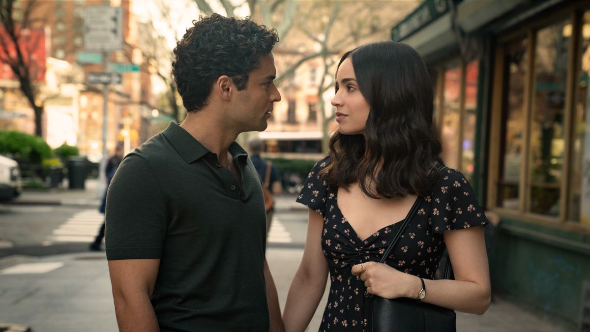 Garrett (Sebastian De Souza) and Alex (Sofia Carson) (L-R) holding hands in Netflix&#039;s &quot;The Life List&quot;