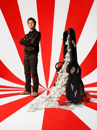 Noel Gallagher with a guitar case full of teabags