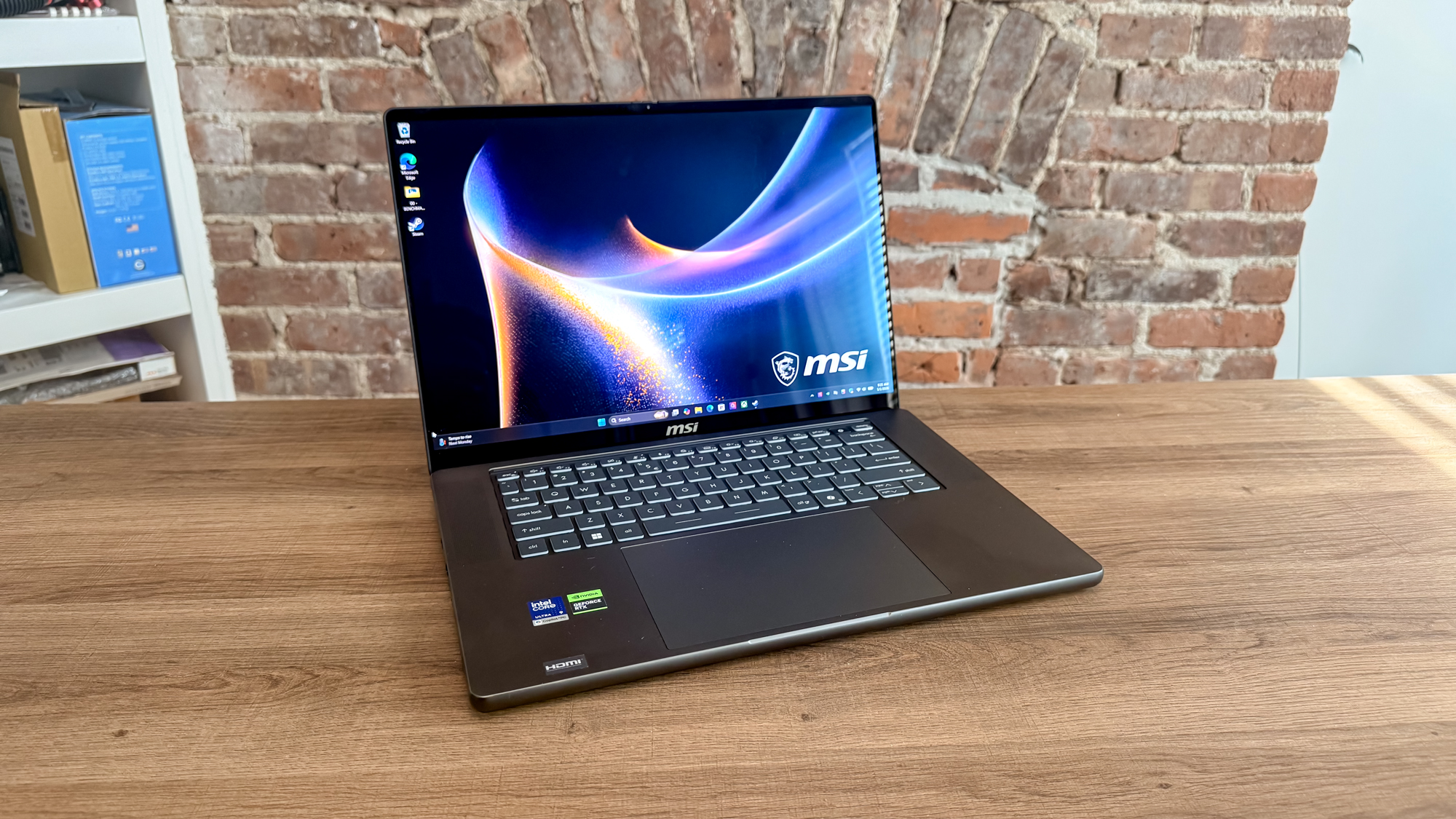 The MSI Stealth 16 AI+ (2026) on a table with its lid open