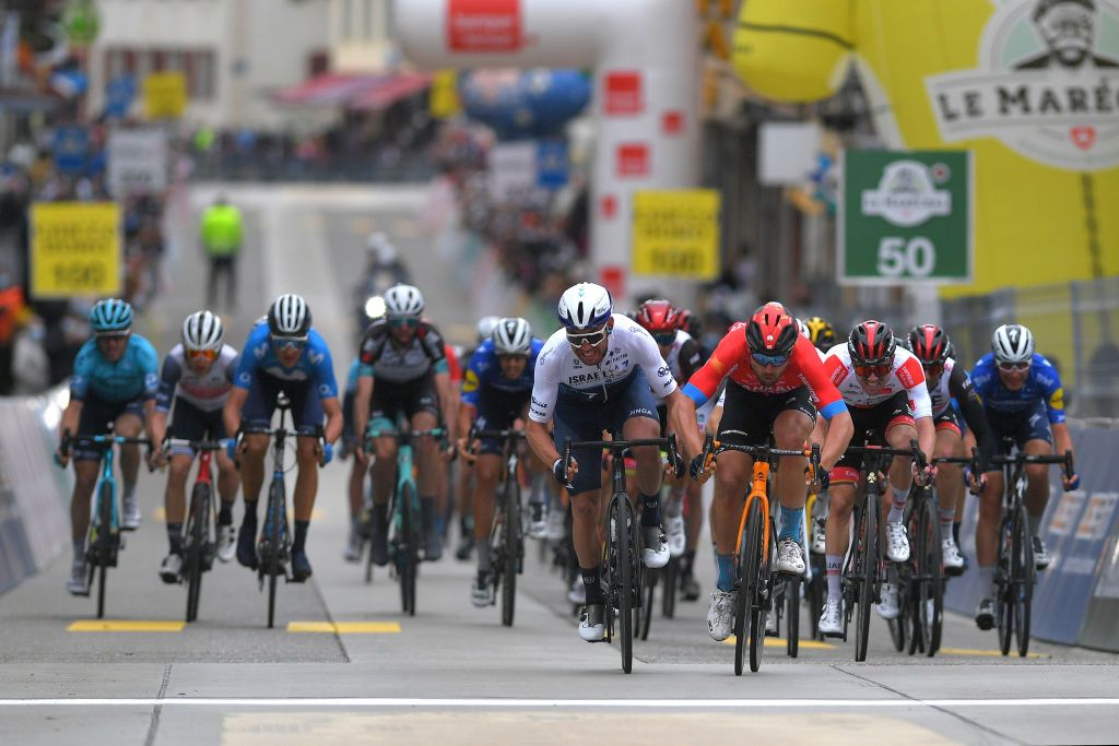 SAINTIMIER SWITZERLAND APRIL 29 Patrick Bevin of New Zealand and Team Israel StartUp Nation Sonny Colbrelli of Italy and Team Bahrain Victorious Marc Hirschi of Switzerland and UAE Team Emirates White Best Young Jersey Sprint at arrival during the 74th Tour De Romandie 2021 Stage 2 a 1657km stage from La Neuveville to SaintImier TDR2021 TDRnonstop UCIworldtour on April 29 2021 in SaintImier Switzerland Photo by Luc ClaessenGetty Images