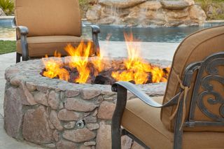 raised firepit by a pool