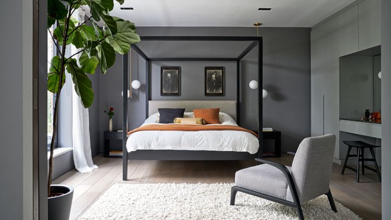 four poster bed in dark grey bedroom