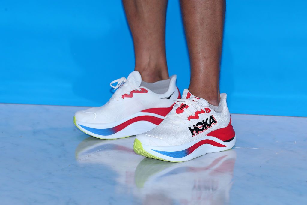 closeup of person wearing Hoka sneakers, which are made by Deckers Outdoor