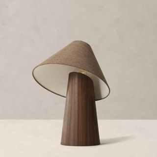 A wooden asymmetrical table lamp
