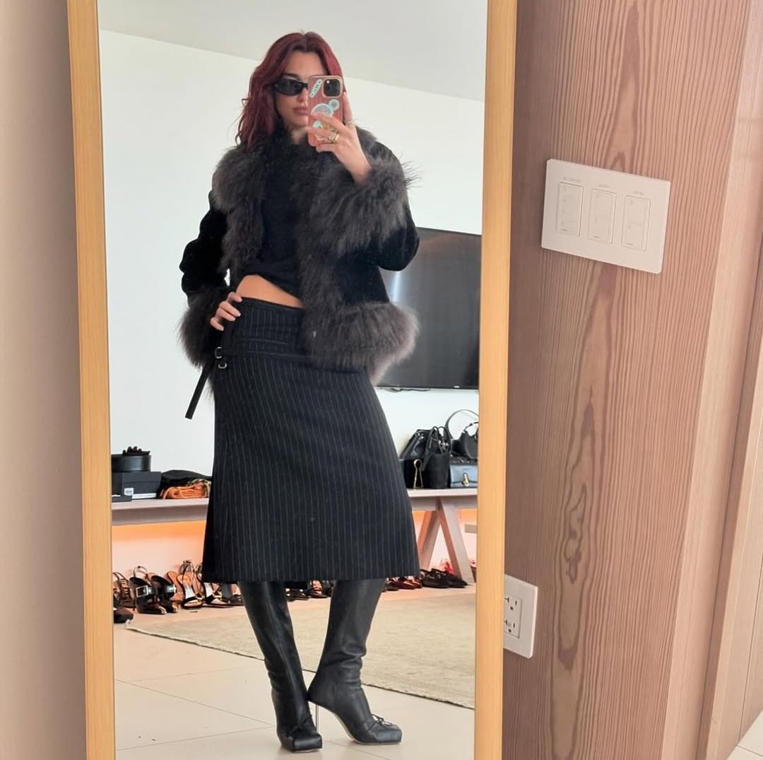 Dua Lipa wearing a Charlotte Simone coat.